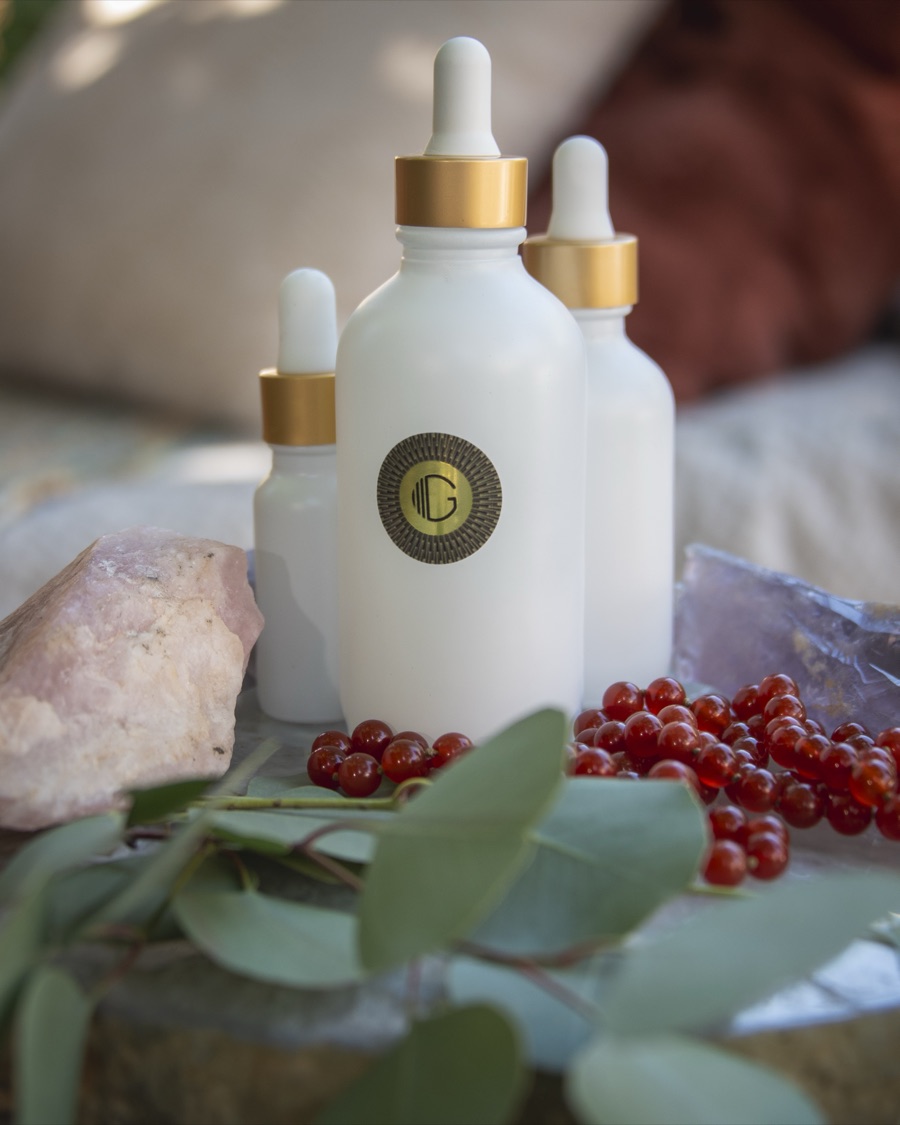 Kissed by G bottles with crystals, eucalyptus and berries